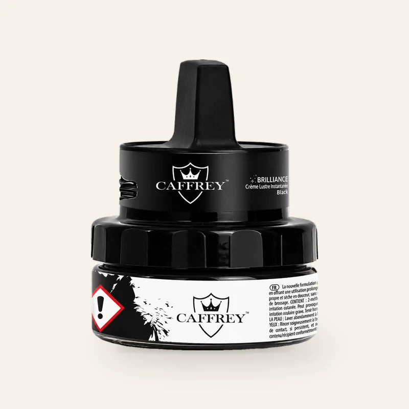 CAFFREY Brilliance Instant Shine Cream, Black, in its closed jar with raised applicator handle.