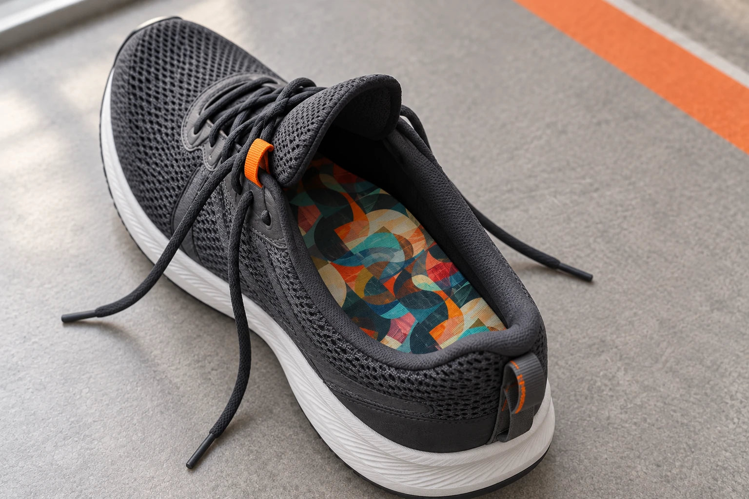 Reference-led scene of the Sprint Sports patterned footbed seated flat inside an open dark trainer.
