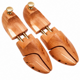 CAFFREY cedar shoe trees with split toes, twin gold-coloured tubes and round heel knobs.