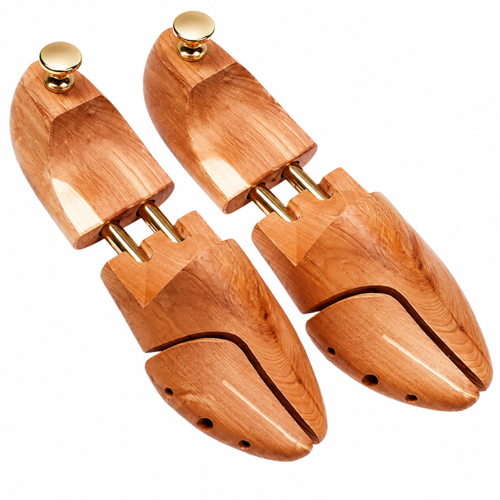 CAFFREY cedar shoe trees with split toes, twin gold-coloured tubes and round heel knobs.