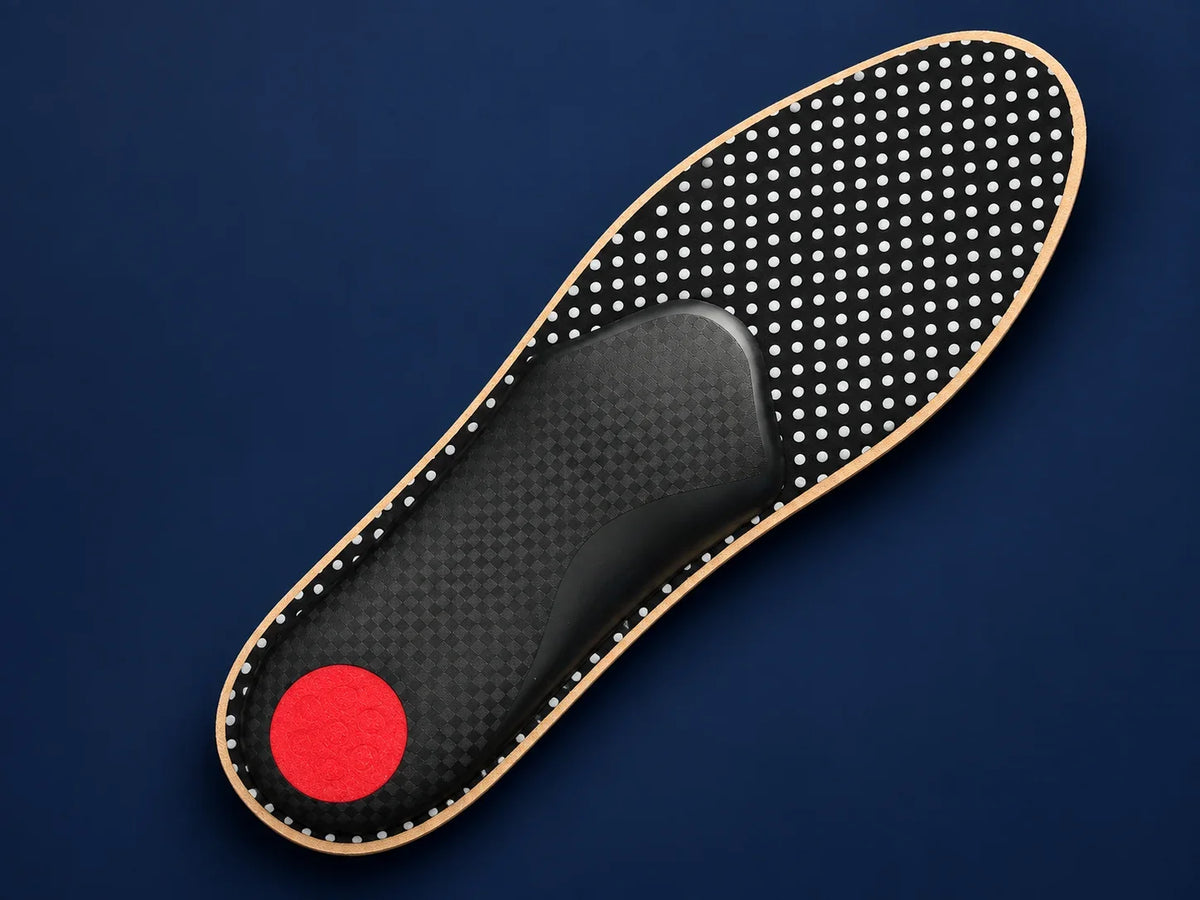 Maestro underside showing the flexible fibre forefoot backing, black support structure and red heel cushion