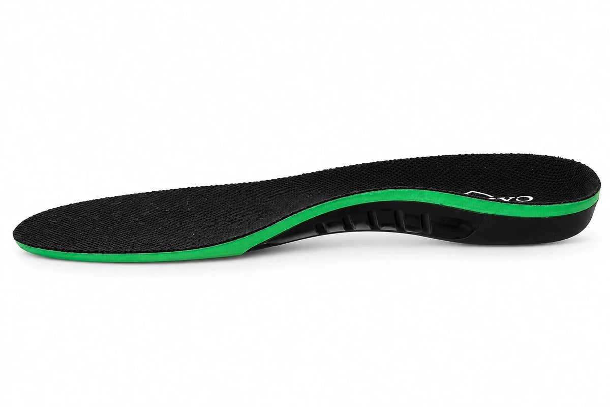 Side profile of a Walk On Air insole showing the thin green forefoot, contoured black arch support and heel cup