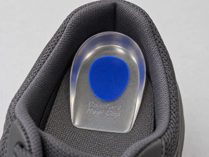 Placement illustration: blue gel heel pad on top of a shoe insole at the heel, coloured oval facing up