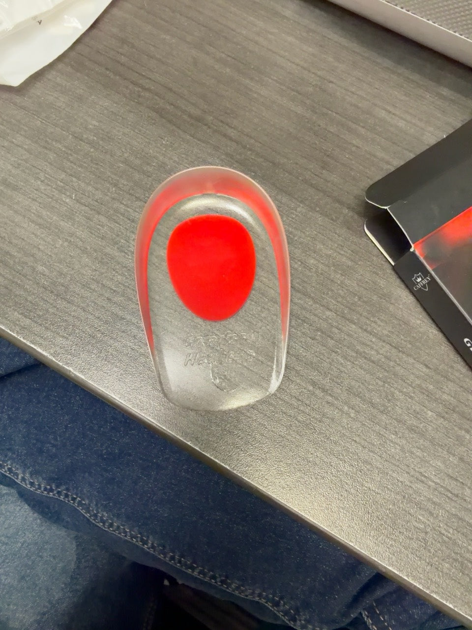 Red Women CAFFREY Gel Heel Pad showing its clear body and red heel insert