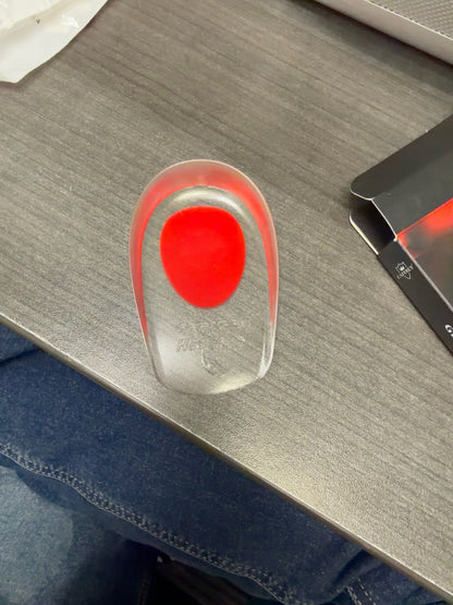 Red Women CAFFREY Gel Heel Pad showing its clear body and red heel insert