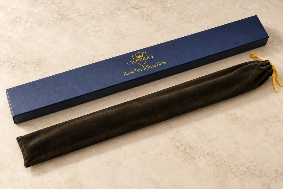 Included navy CAFFREY Royal Touch gift box and dark drawstring pouch with flat gold ribbon ties