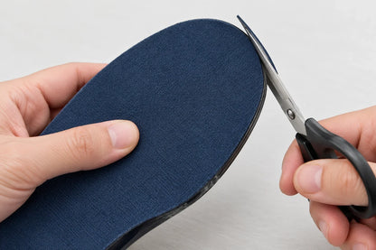 Trimming a narrow strip from the toe of Step Aid, navy fabric side up