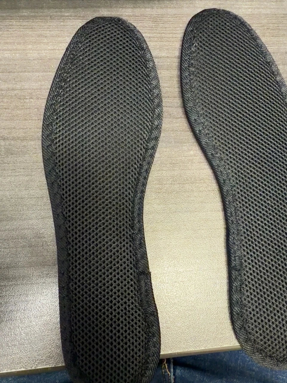 Actual CAFFREY Zephyr insoles showing the black open-mesh top that faces the foot