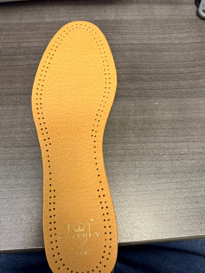 Owner photograph of the actual tan Eleganza sheep-leather top, edge perforations and CAFFREY heel mark