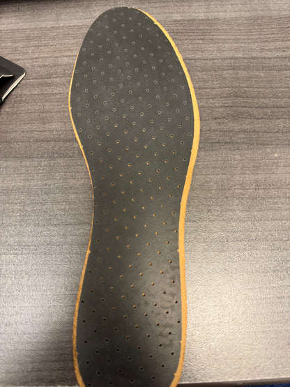 Owner photograph of the actual smooth charcoal perforated underside of tan Eleganza