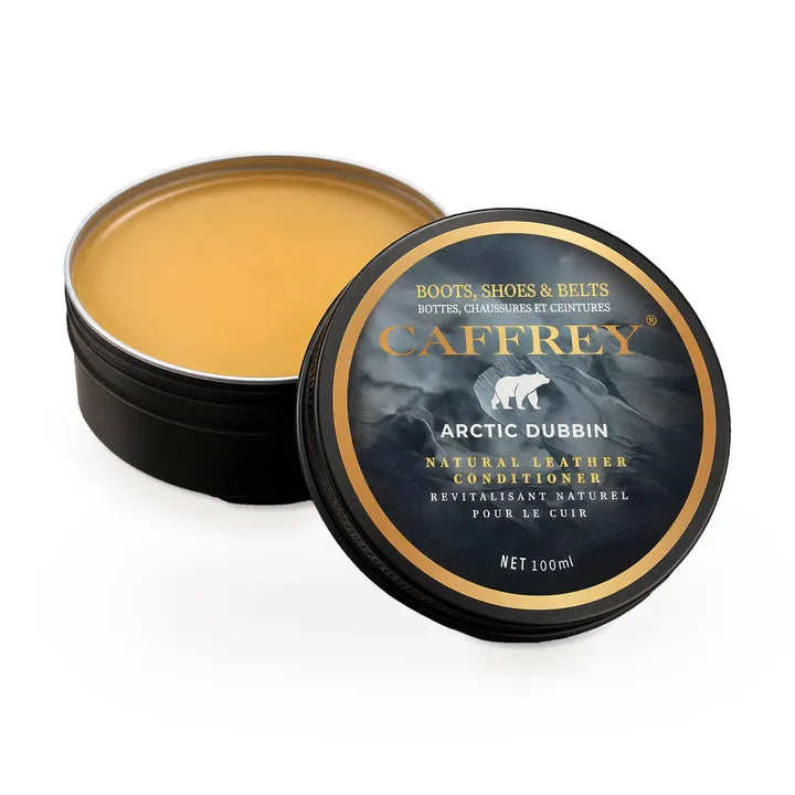 CAFFREY Arctic Dubbin tin, open, with amber balm and its polar-bear lid
