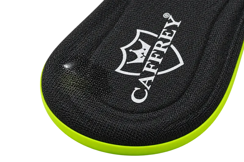 Black anti-slip fabric top of a Comfort Max insole with the CAFFREY crest, showing sweat soaking into the fabric