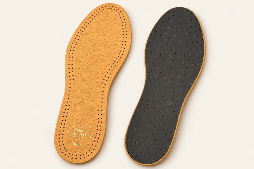 Two sides of the slim Eleganza insole: tan perforated leather and dark cushioned reverse