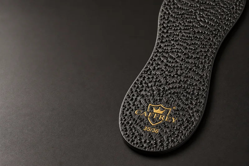 Detail of the raised-dot pattern on the black sheep-leather insole