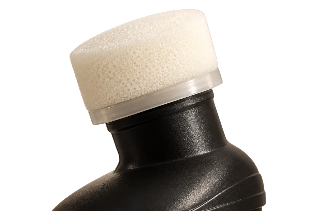 Illustration: the sponge head and angled neck of the bottle, cap removed