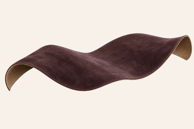 Illustration of water beads resting on a ribbon of plum suede