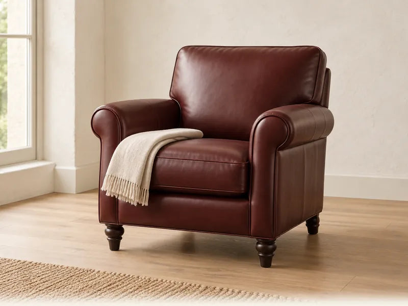 Illustration of a smooth oxblood leather armchair in soft daylight