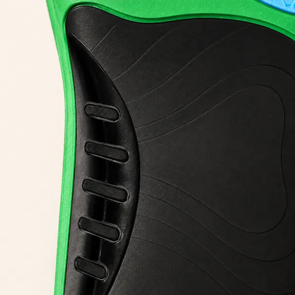 Underside of a Walk On Air insole at the arch: black moulded shell with five ribs along the inner edge